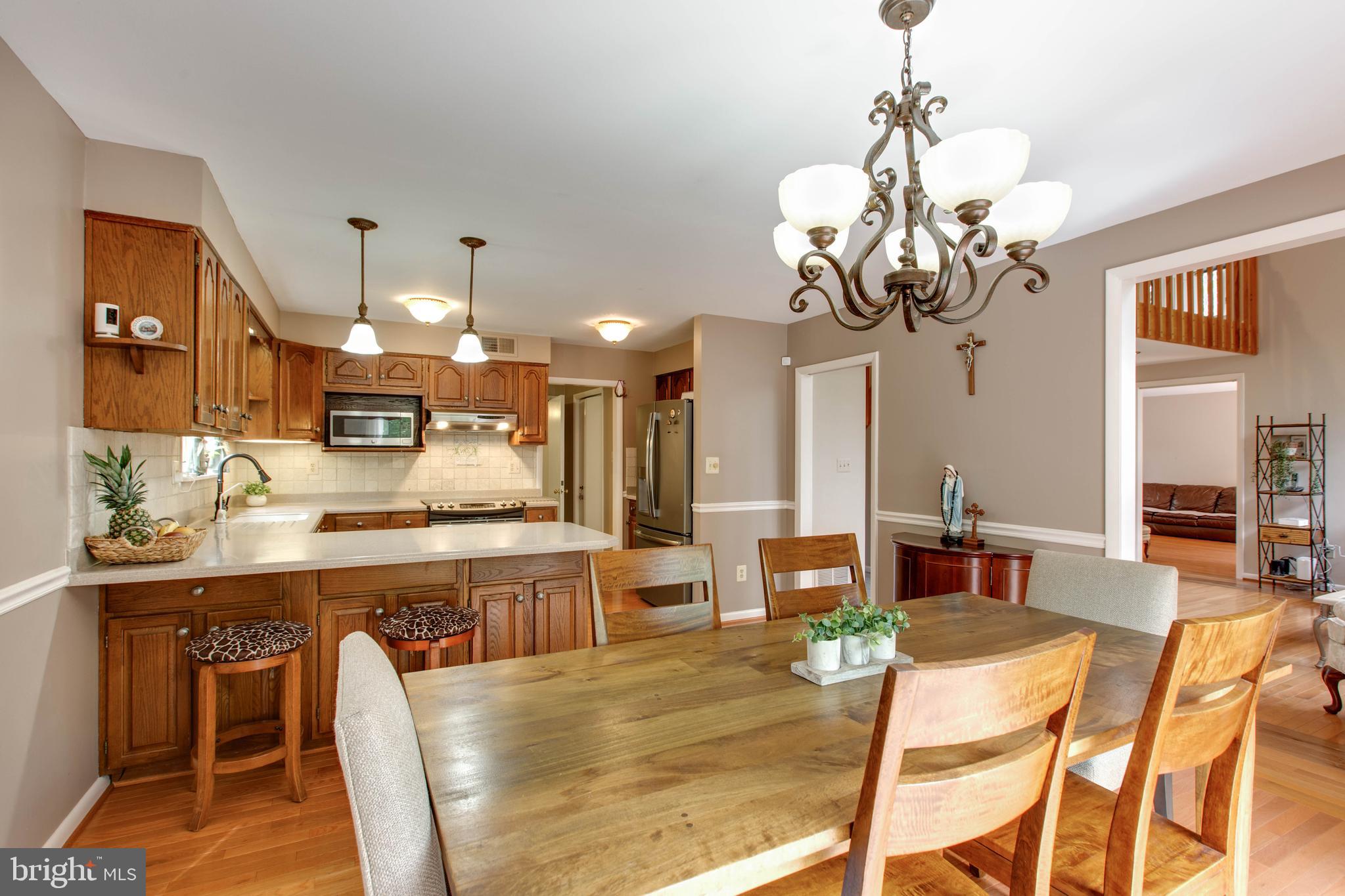 5519 Woodbine Road Sykesville, MD 21784 - Photo 20 of 69 a large kitchen with a table and chairs in it