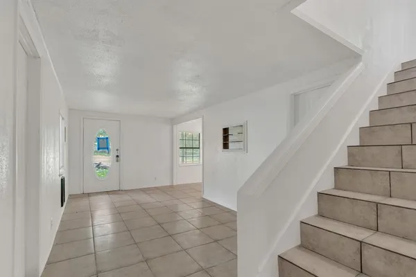 a view of an entryway with stairs