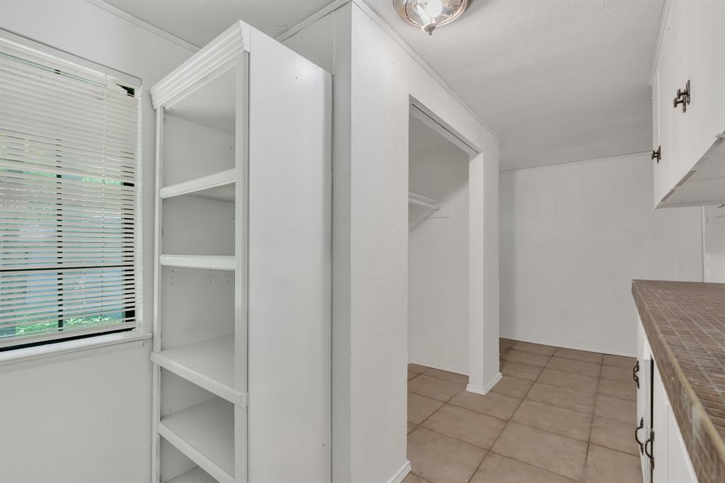 84 Natchez Road Pottsboro, TX 75076 - Photo 15 of 37 a view of an empty walk in closet