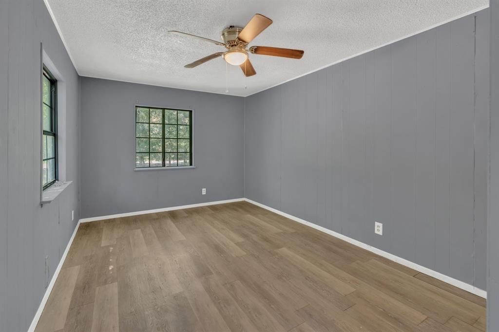 84 Natchez Road Pottsboro, TX 75076 - Photo 20 of 37 wooden floor in an empty room with a window