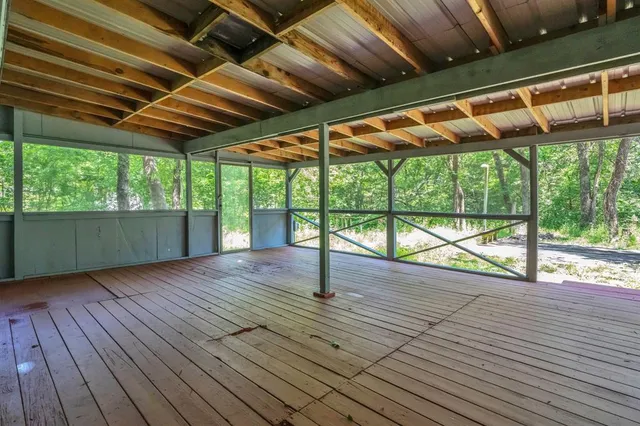 a view of porch with wooden floor