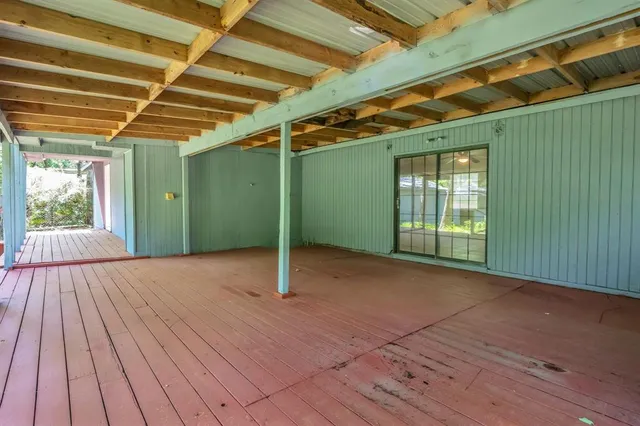 a view of an empty room with windows