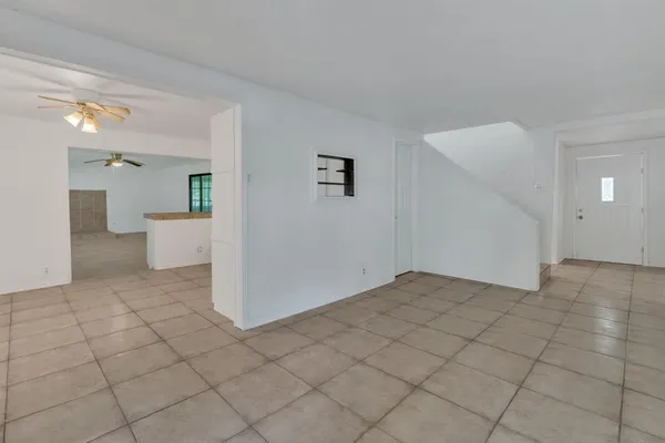 a view of a big room with closet and windows