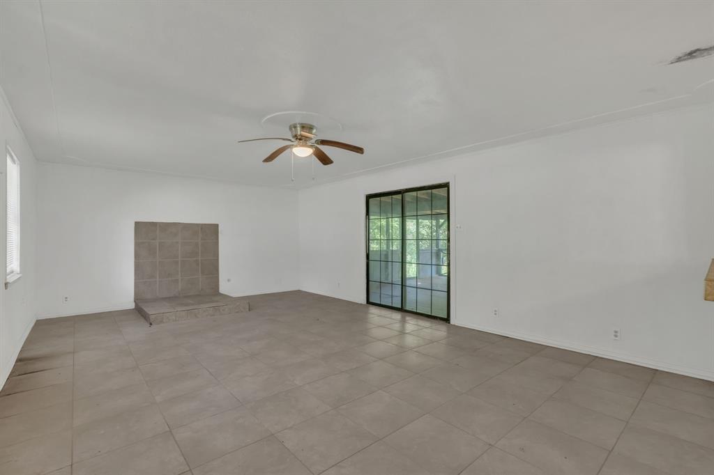 84 Natchez Road Pottsboro, TX 75076 - Photo 9 of 37 a view of an empty room with a window