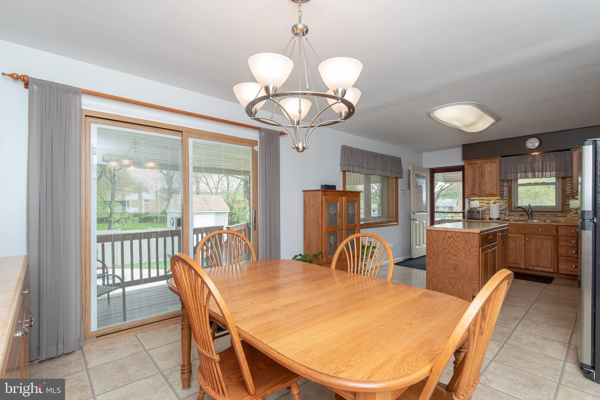 4310 Camellia Road Baltimore, MD 21236 - Photo 25 of 55 Dining Area with Sliders to Covered Deck