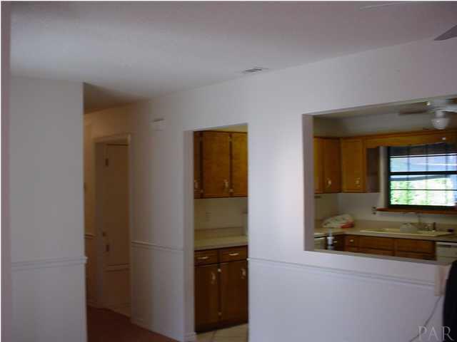 4220 Jernigan Road Pace, FL 32571 - Photo 3 of 7 a bathroom with a sink and a mirror