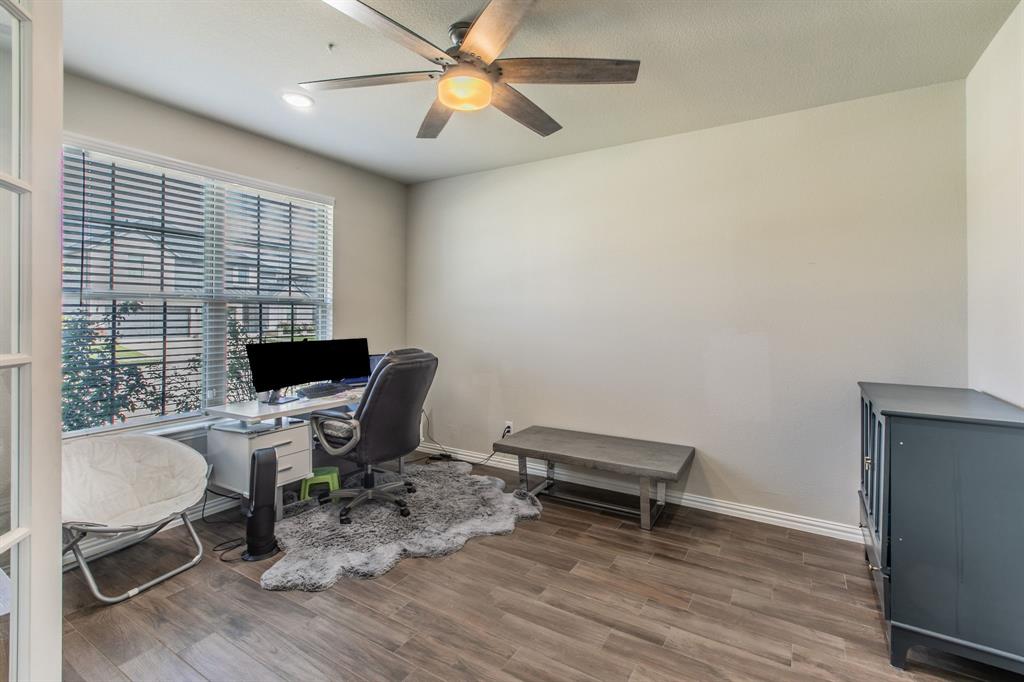 2521 Maidenhair Road Frisco, TX 75033 - Photo 15 of 39 Room featuring wood-finish flooring, a ceiling fan with integrated lighting, recessed lighting, and a large window with horizontal blinds