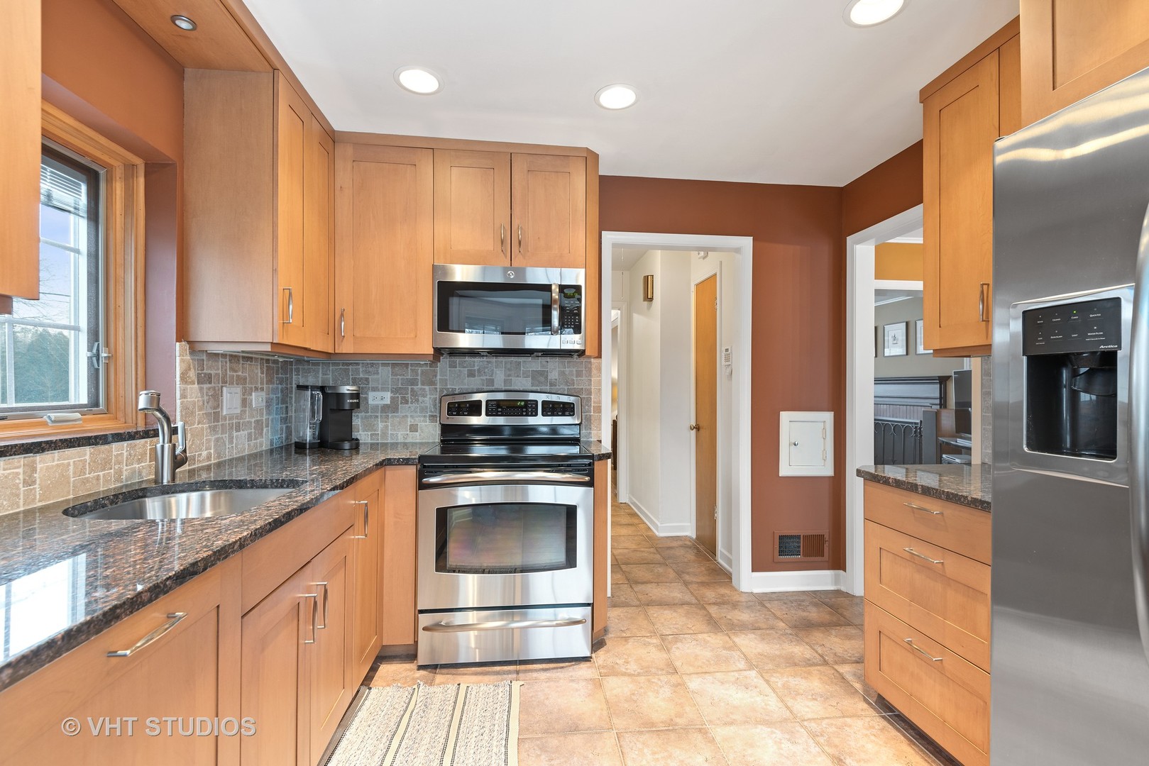 734 Beaver Road Glenview, IL 60025 - Photo 11 of 26 a kitchen with stainless steel appliances granite countertop a refrigerator and a sink