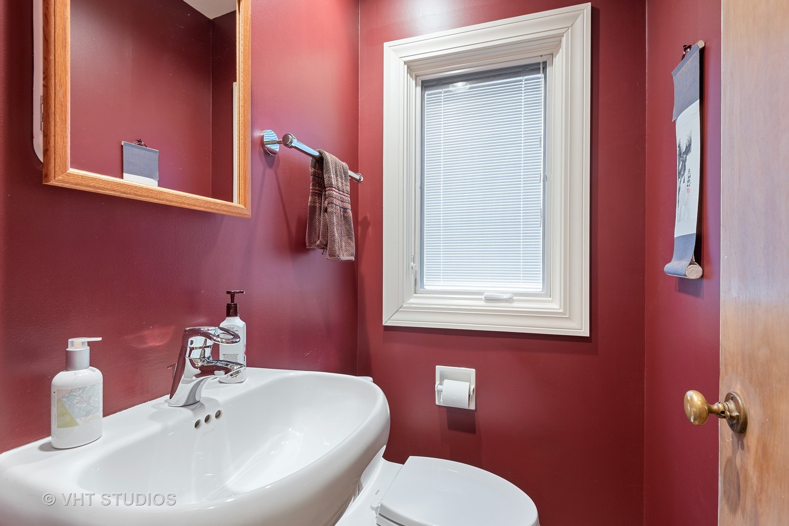 734 Beaver Road Glenview, IL 60025 - Photo 12 of 26 a bathroom with a toilet a sink and mirror