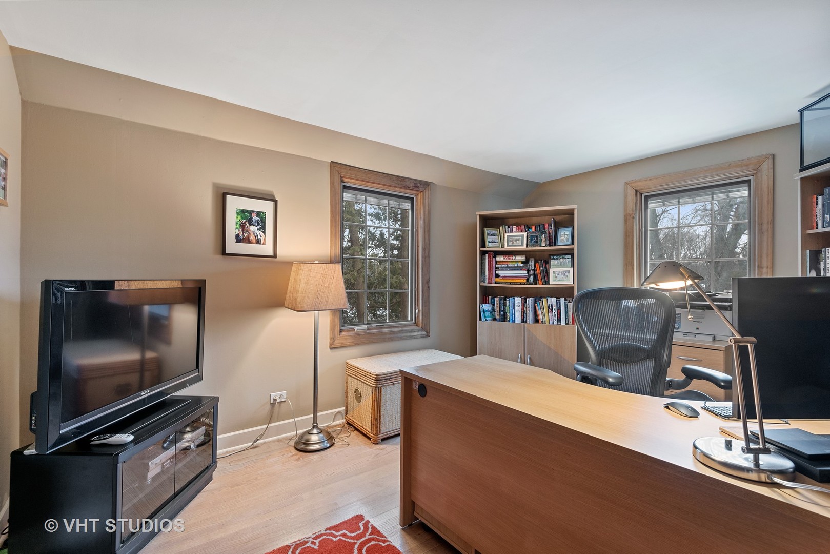 734 Beaver Road Glenview, IL 60025 - Photo 15 of 26 a living room with furniture a flat screen tv and a window