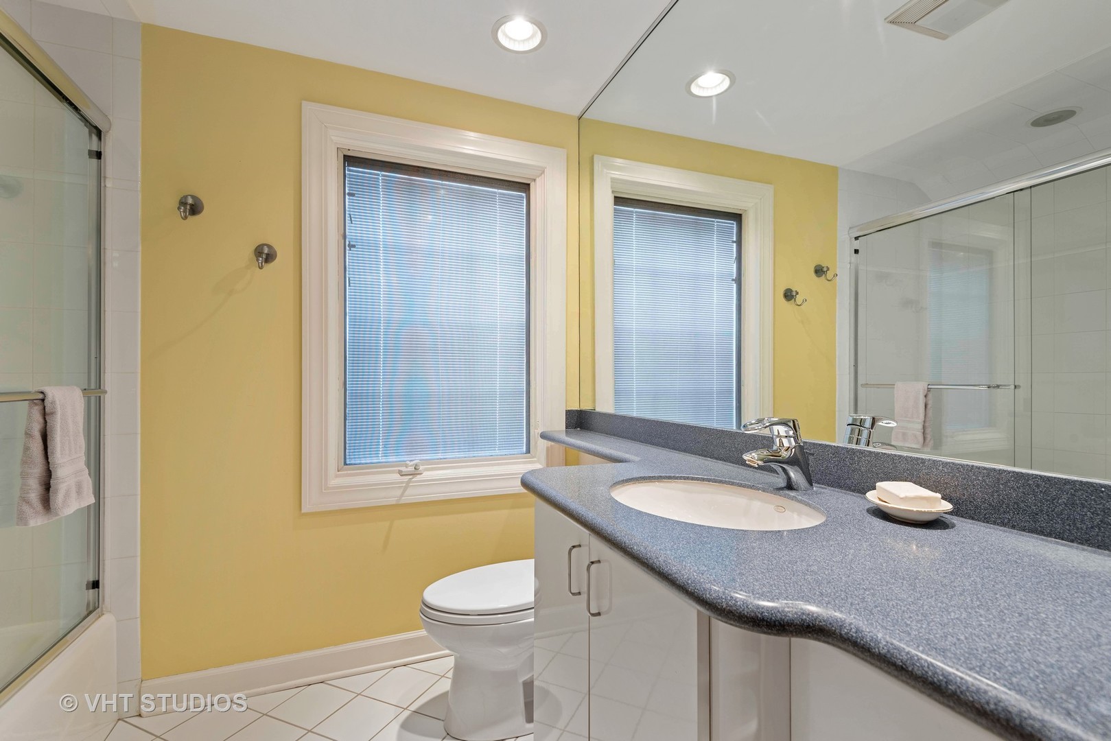 734 Beaver Road Glenview, IL 60025 - Photo 17 of 26 a bathroom with a granite countertop sink toilet and shower