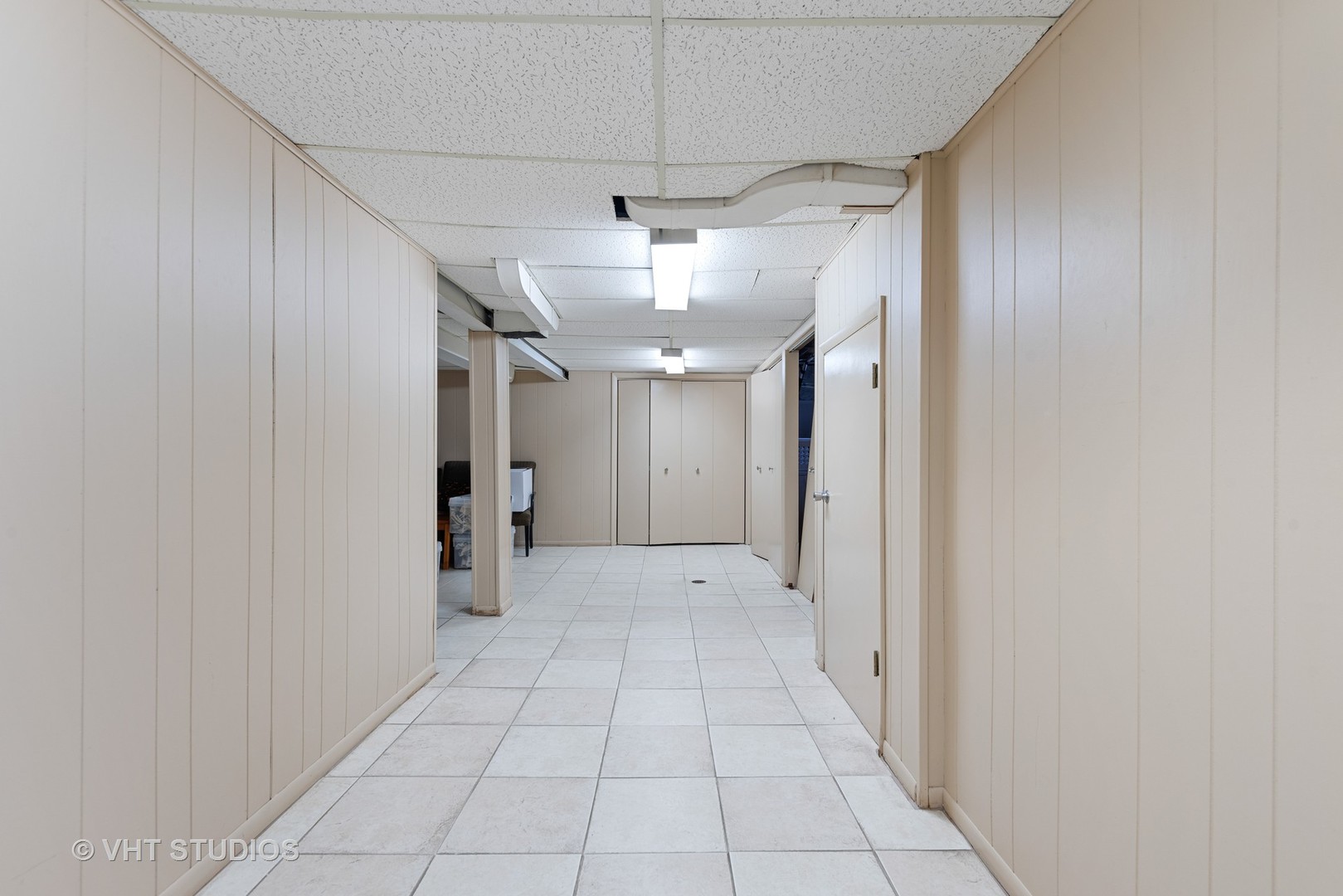 734 Beaver Road Glenview, IL 60025 - Photo 18 of 26 a view of a hallway with a chandelier