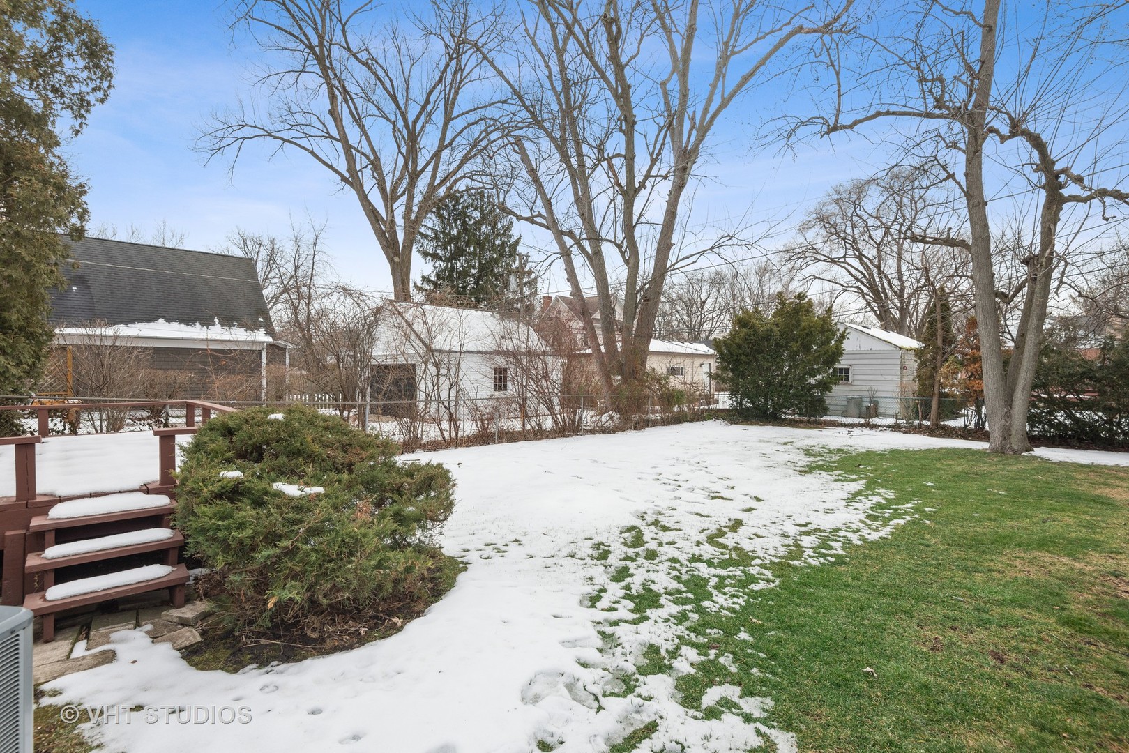 734 Beaver Road Glenview, IL 60025 - Photo 21 of 26 a view of a yard covered in snow