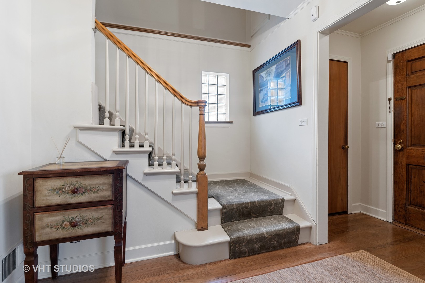 734 Beaver Road Glenview, IL 60025 - Photo 4 of 26 a view of entryway and hall with wooden floor