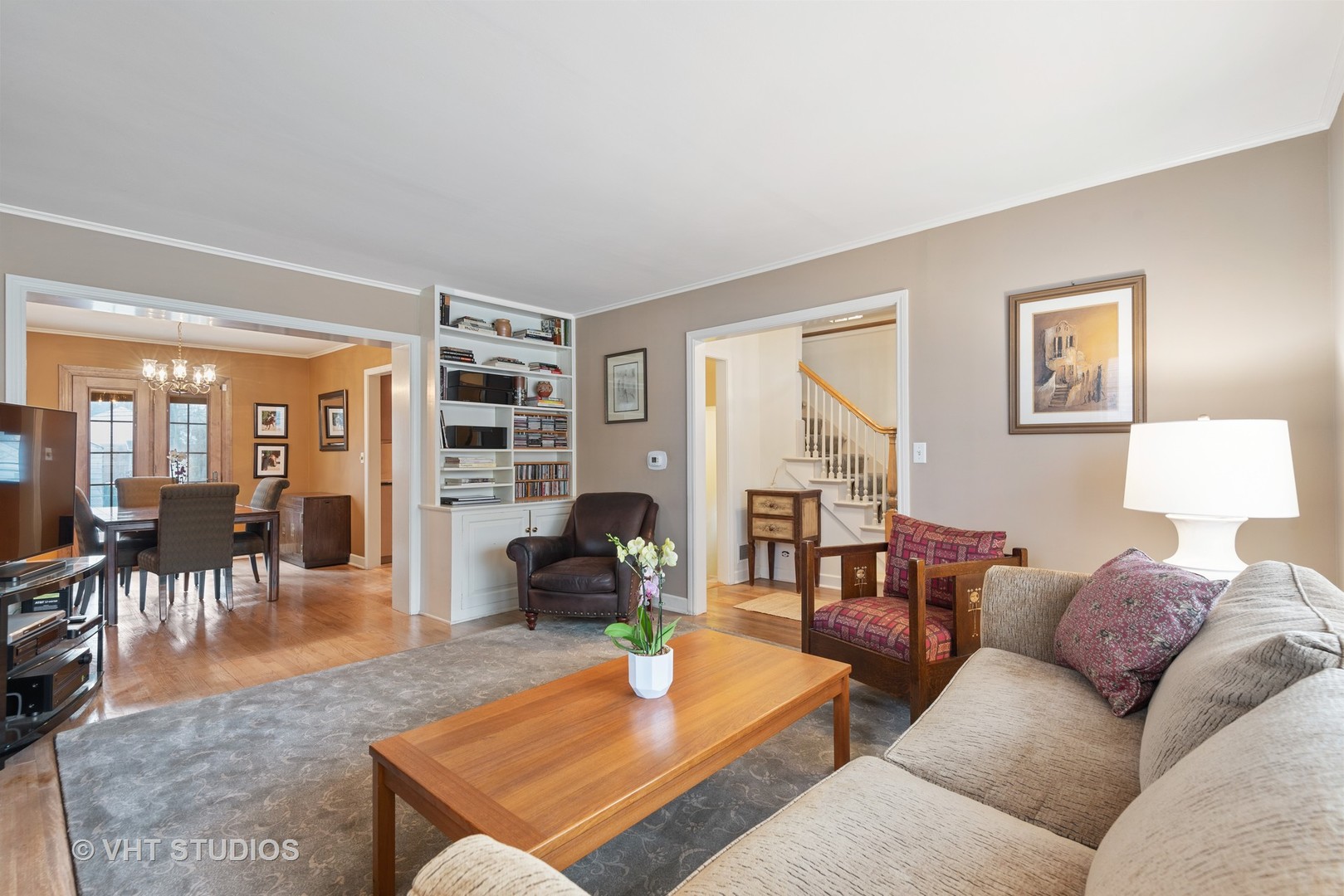 734 Beaver Road Glenview, IL 60025 - Photo 7 of 26 a living room with furniture a table and a large window