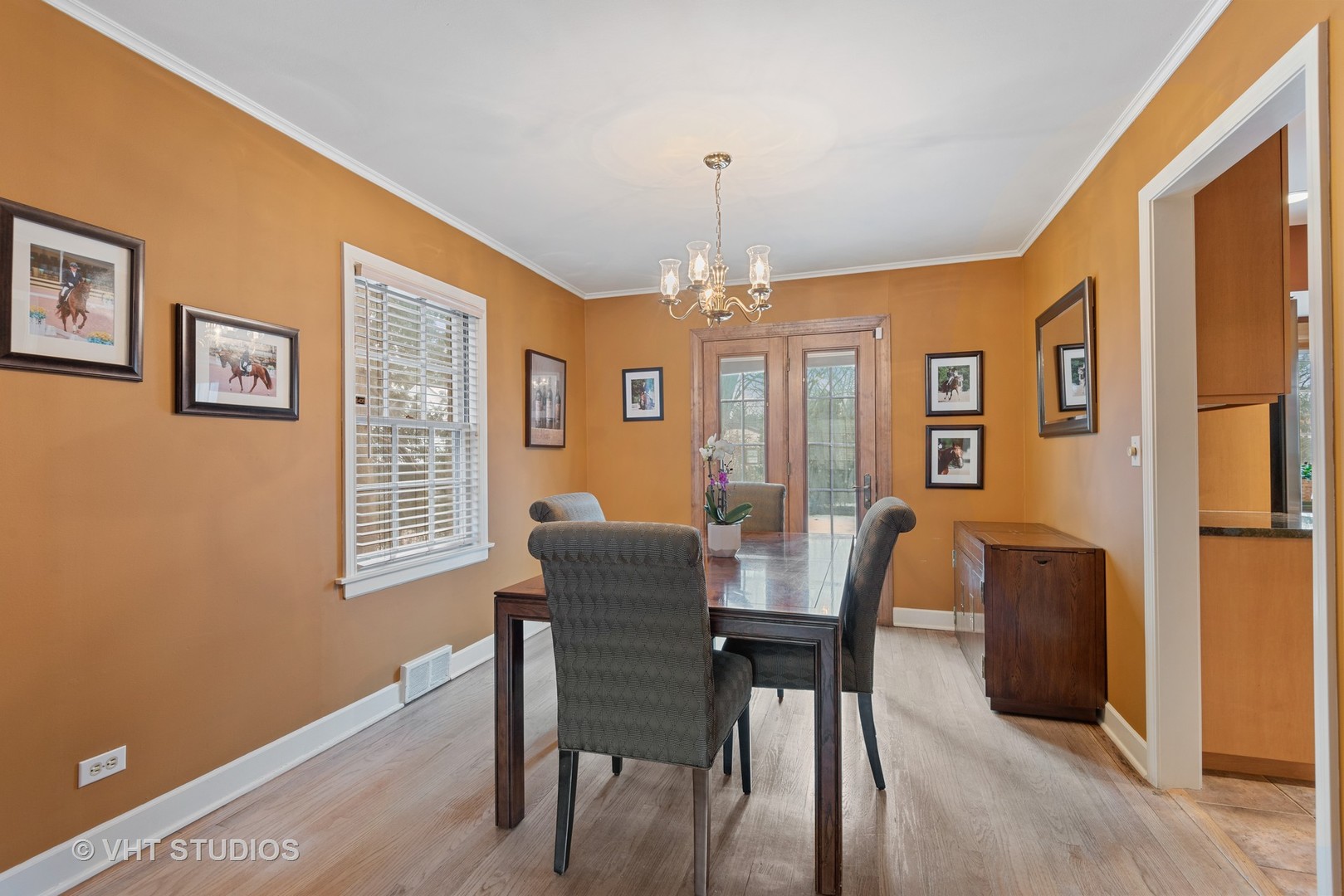 734 Beaver Road Glenview, IL 60025 - Photo 9 of 26 a dining room with furniture a chandelier and wooden floor