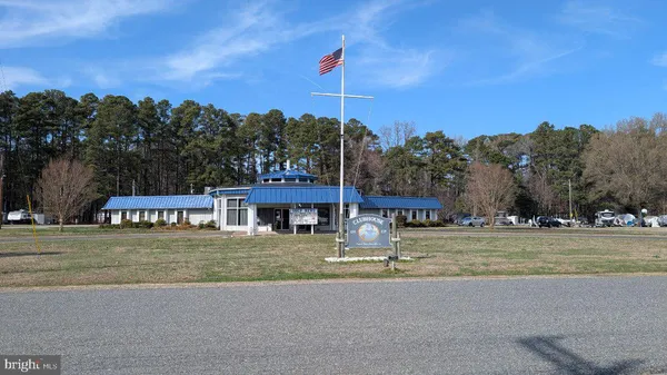 a large kitchen with a table and chairs