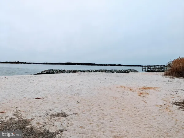 a view of a swimming pool and a yard