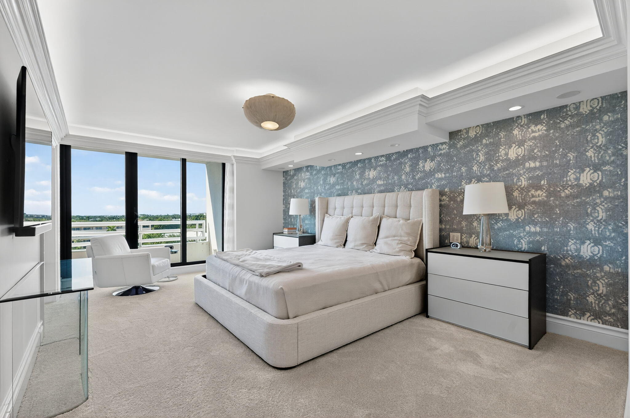 1400 South Ocean Boulevard, Unit 605 Boca Raton, FL 33432 - Photo 18 of 77 a spacious bedroom with a bed and large window