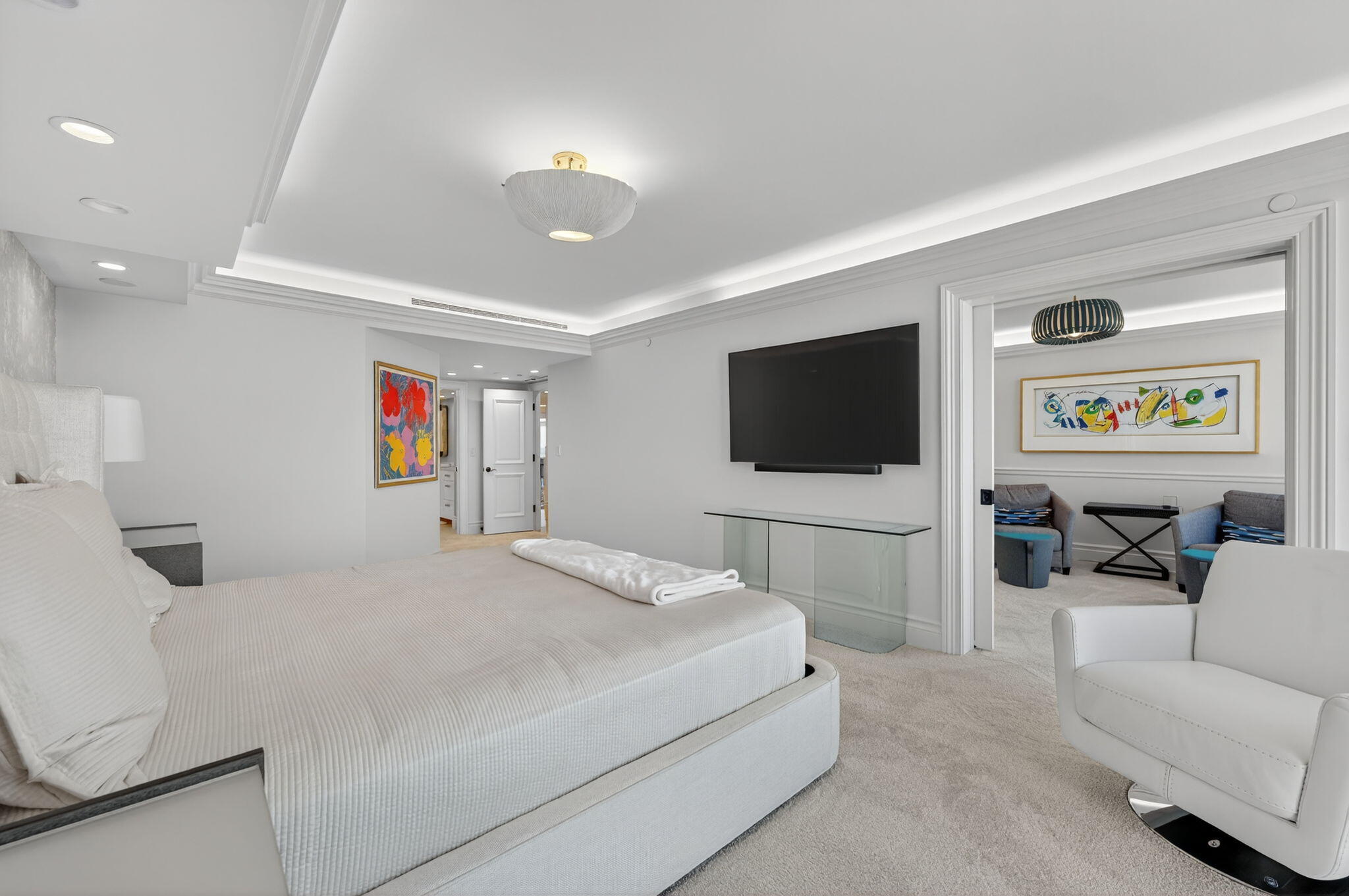 1400 South Ocean Boulevard, Unit 605 Boca Raton, FL 33432 - Photo 20 of 77 a bedroom with a bed and a flat screen tv