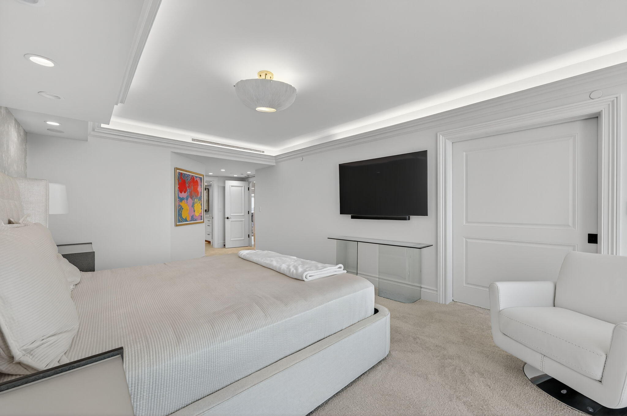 1400 South Ocean Boulevard, Unit 605 Boca Raton, FL 33432 - Photo 21 of 77 a bedroom with a bed a television and a couch