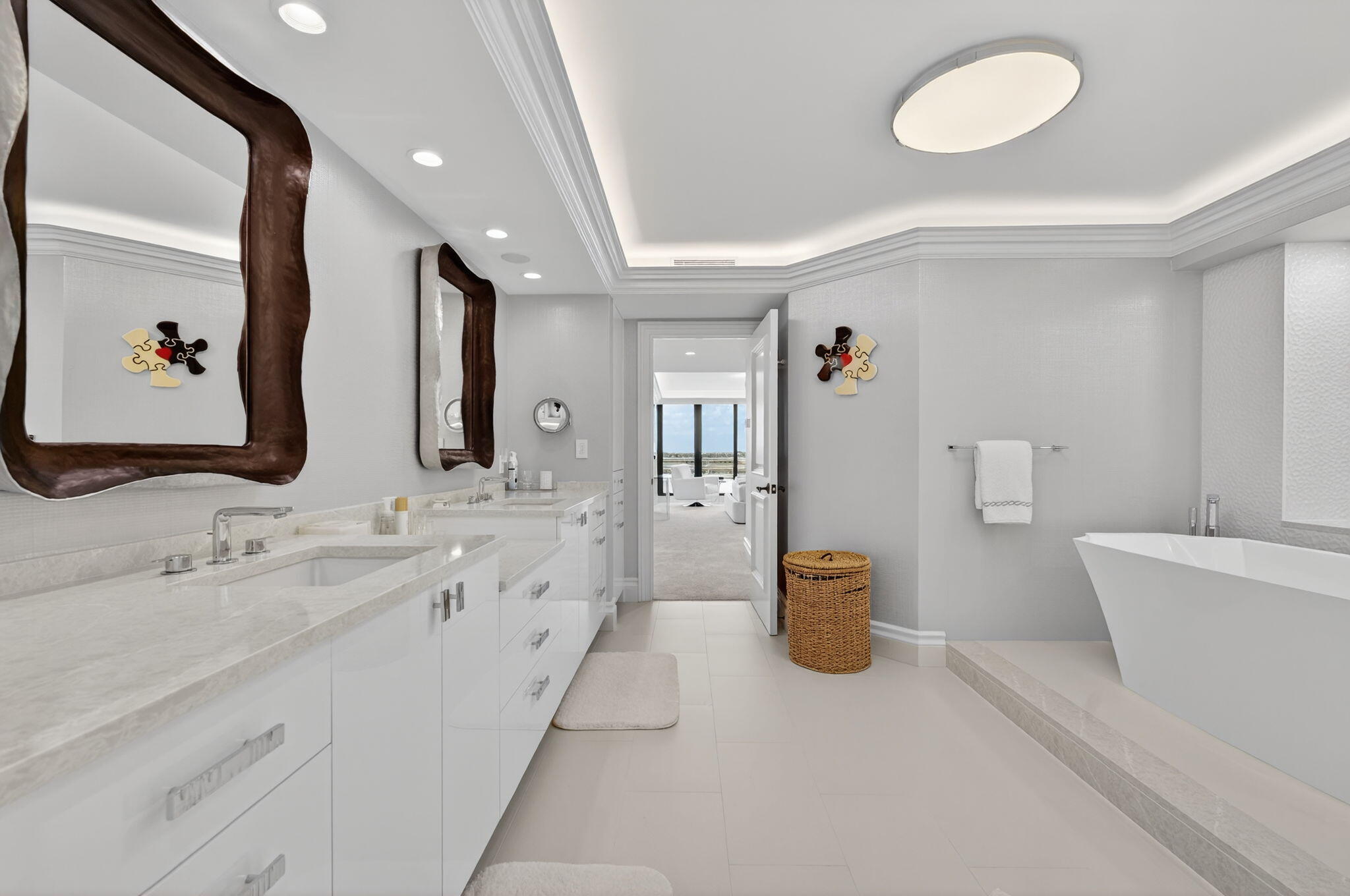 1400 South Ocean Boulevard, Unit 605 Boca Raton, FL 33432 - Photo 24 of 77 a bathroom with a double vanity sink a toilet and a mirror