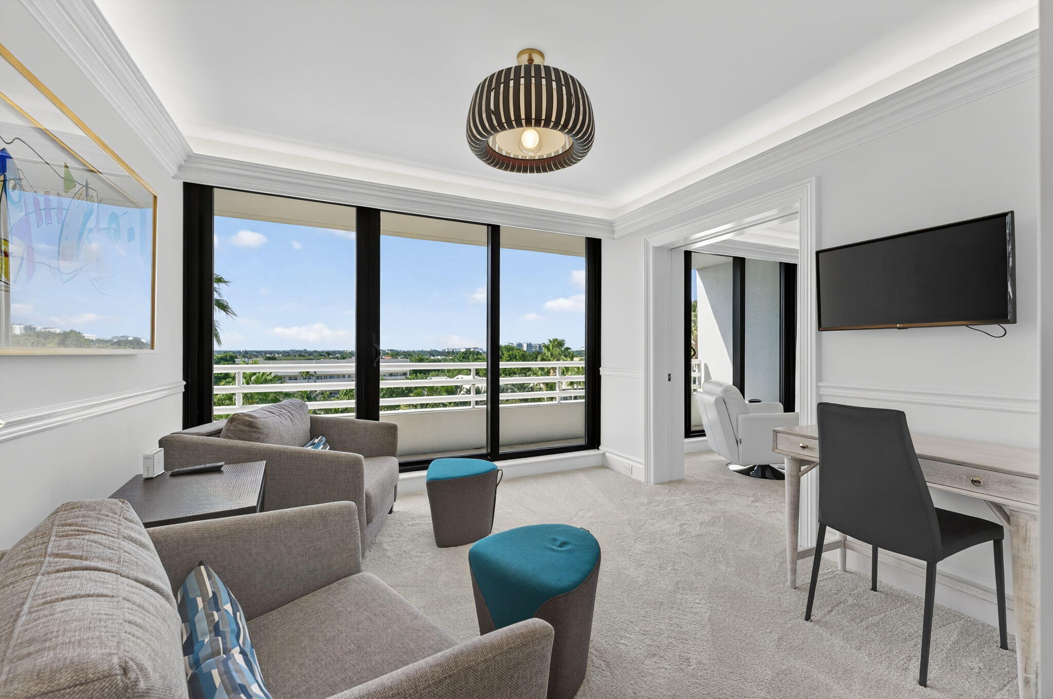 1400 South Ocean Boulevard, Unit 605 Boca Raton, FL 33432 - Photo 26 of 77 a living room with furniture a flat screen tv and a large window