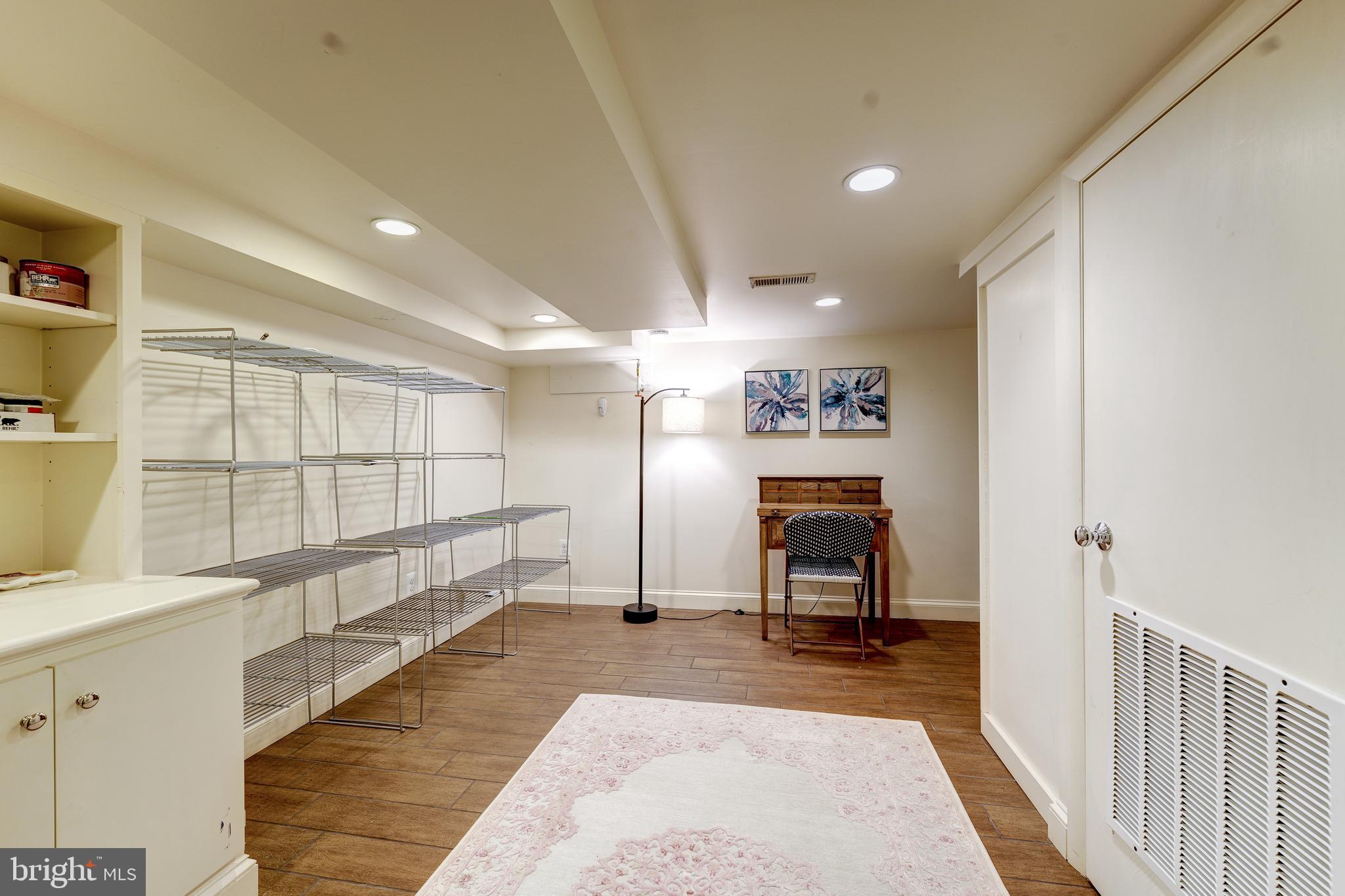 1237 29th Street Northwest Washington, DC 20007 - Photo 24 of 37 Recreation Room w/shelving in Lower Level