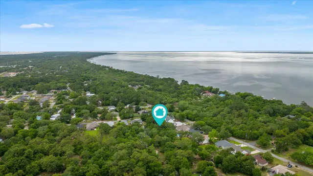 a view of a green field with lots of bushes