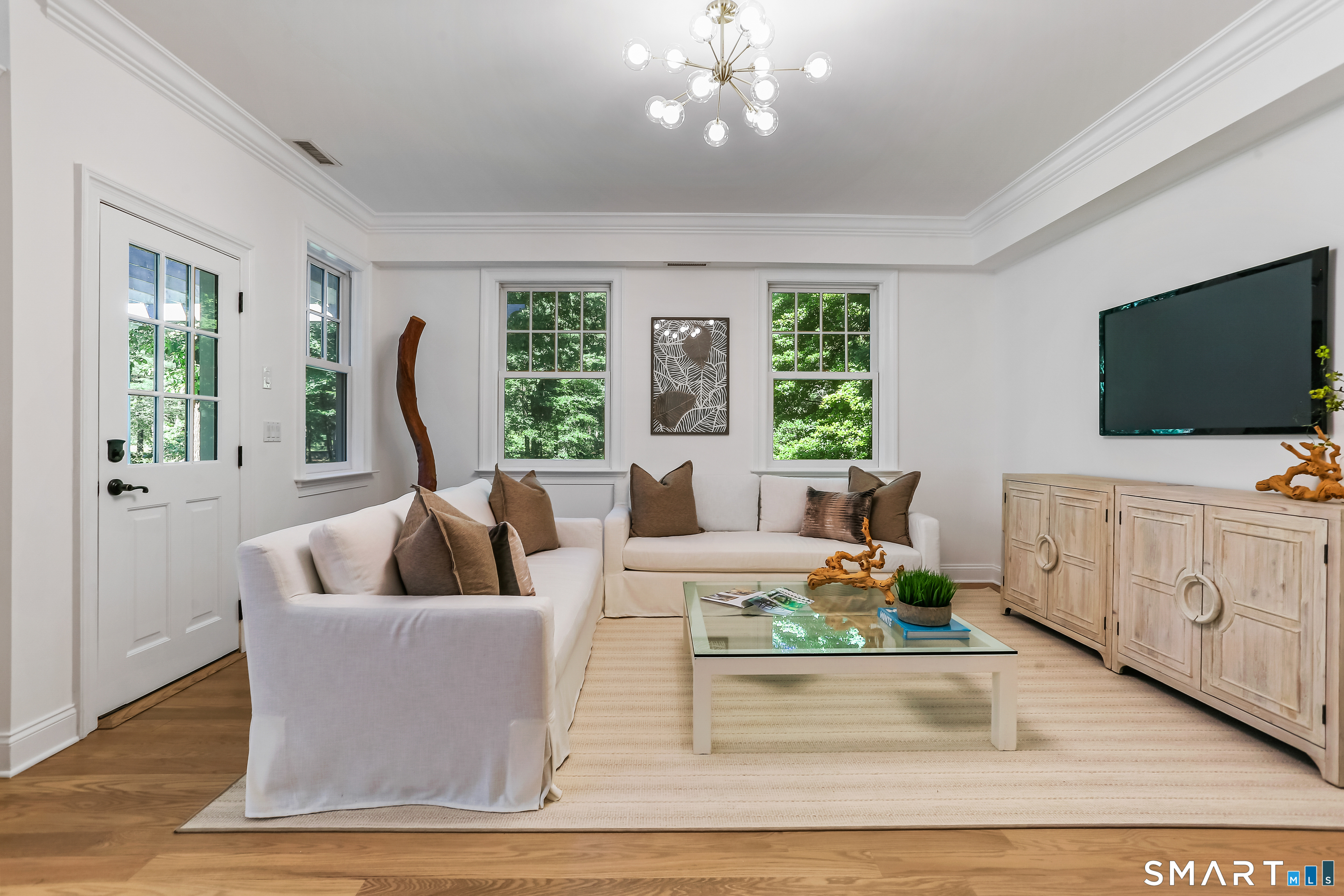 21 Woods Grove Road Westport, CT 06880 - Photo 18 of 38 Family Room overlooks the River. Note the door on the left. It accesses the Terrace.