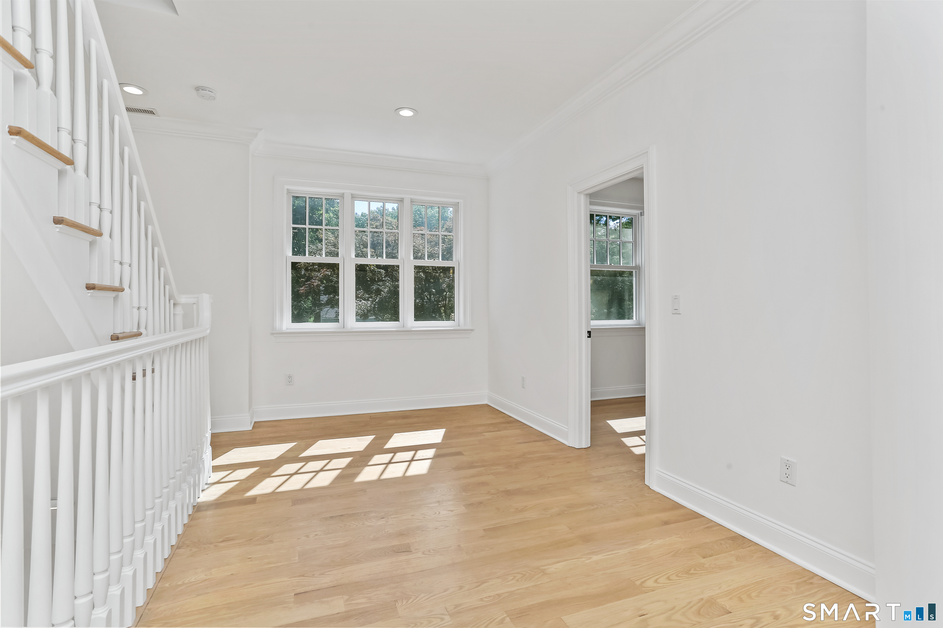 21 Woods Grove Road Westport, CT 06880 - Photo 30 of 38 The wide landing on second floor can be homeowrk or hang out area and also has stairs to the 3rd level