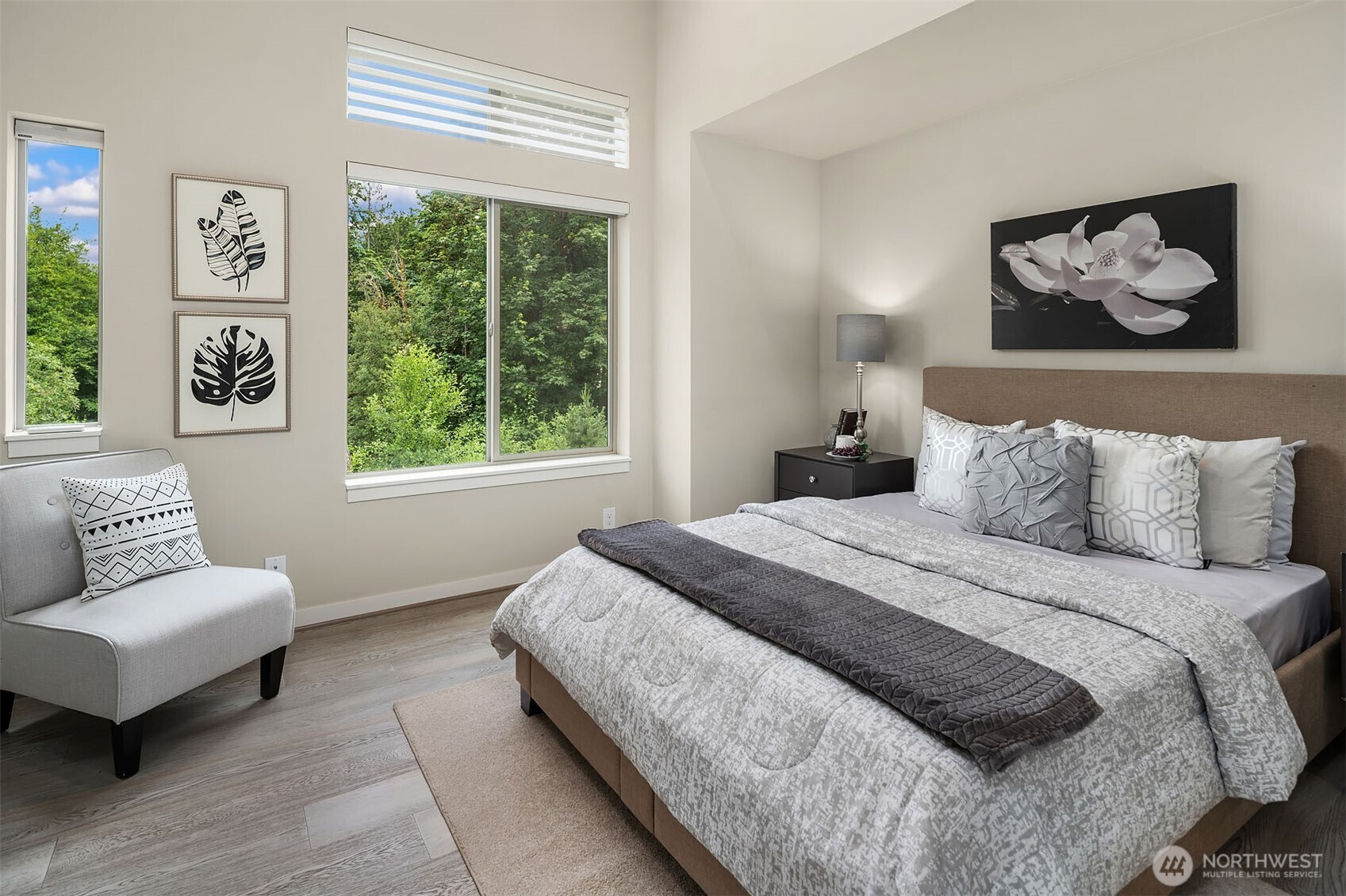 1910 Riva Lane Northwest Issaquah, WA 98027 - Photo 13 of 31 a bedroom with a bed painting on wall and a large window
