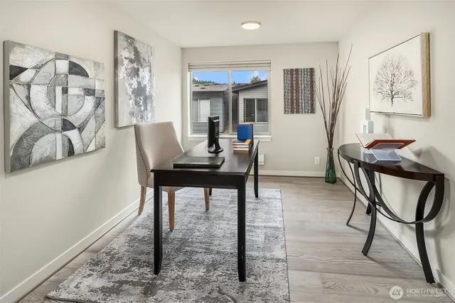 a workspace with furniture and window