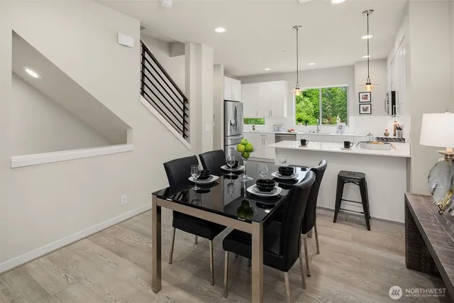 a dining room with furniture and window