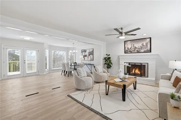a living room with furniture a window and a fireplace