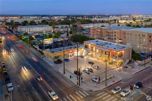 an aerial view of a balcony with outdoor seating