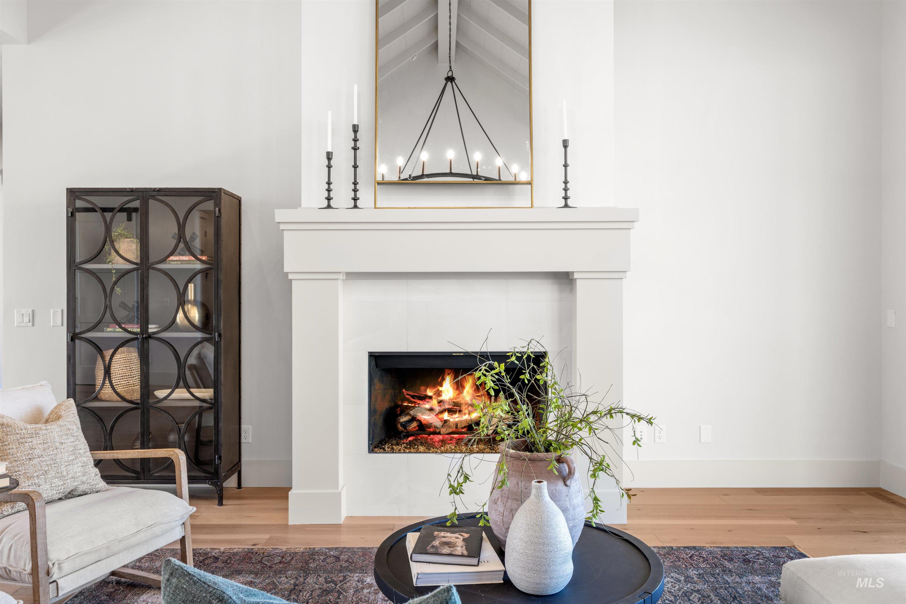 10968 North Elk Ridge Place Boise, ID 83714 - Photo 19 of 49 Sitting room with wood finished floors and a tile fireplace