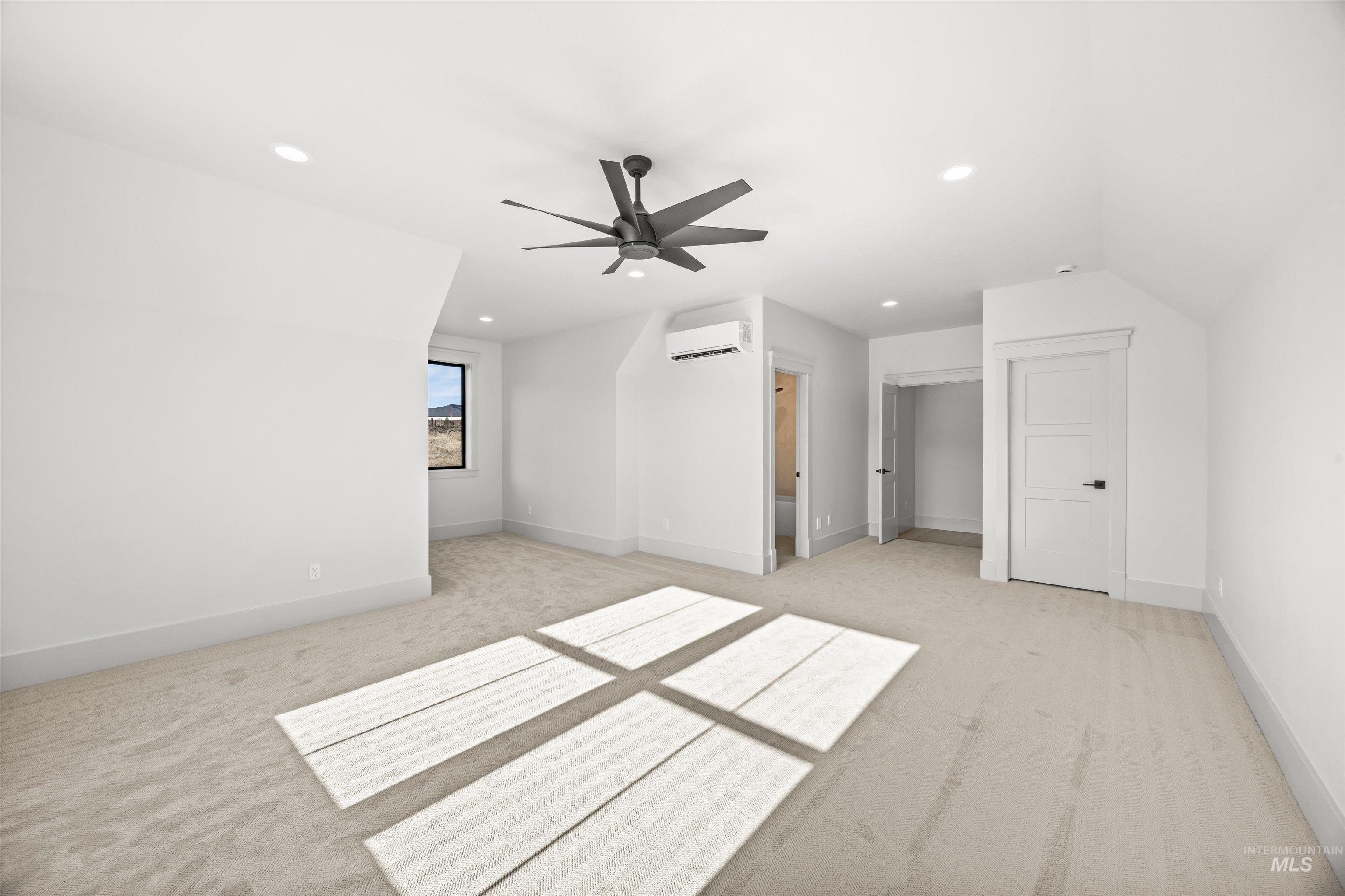 10968 North Elk Ridge Place Boise, ID 83714 - Photo 33 of 49 Unfurnished bedroom with light carpet, ceiling fan, recessed lighting, and ensuite bath