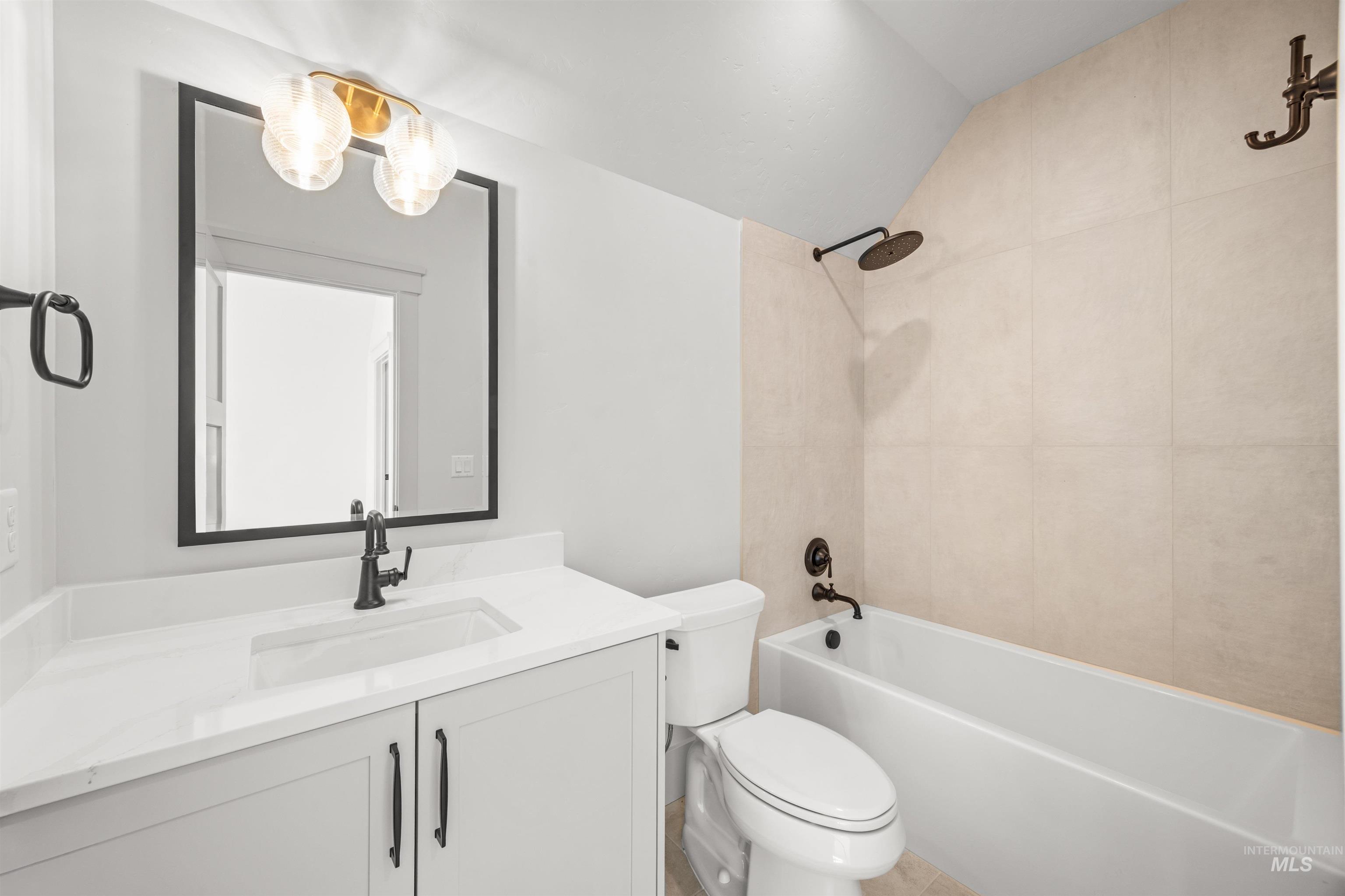 10968 North Elk Ridge Place Boise, ID 83714 - Photo 34 of 49 Full bath featuring vanity, shower combination, and vaulted ceiling