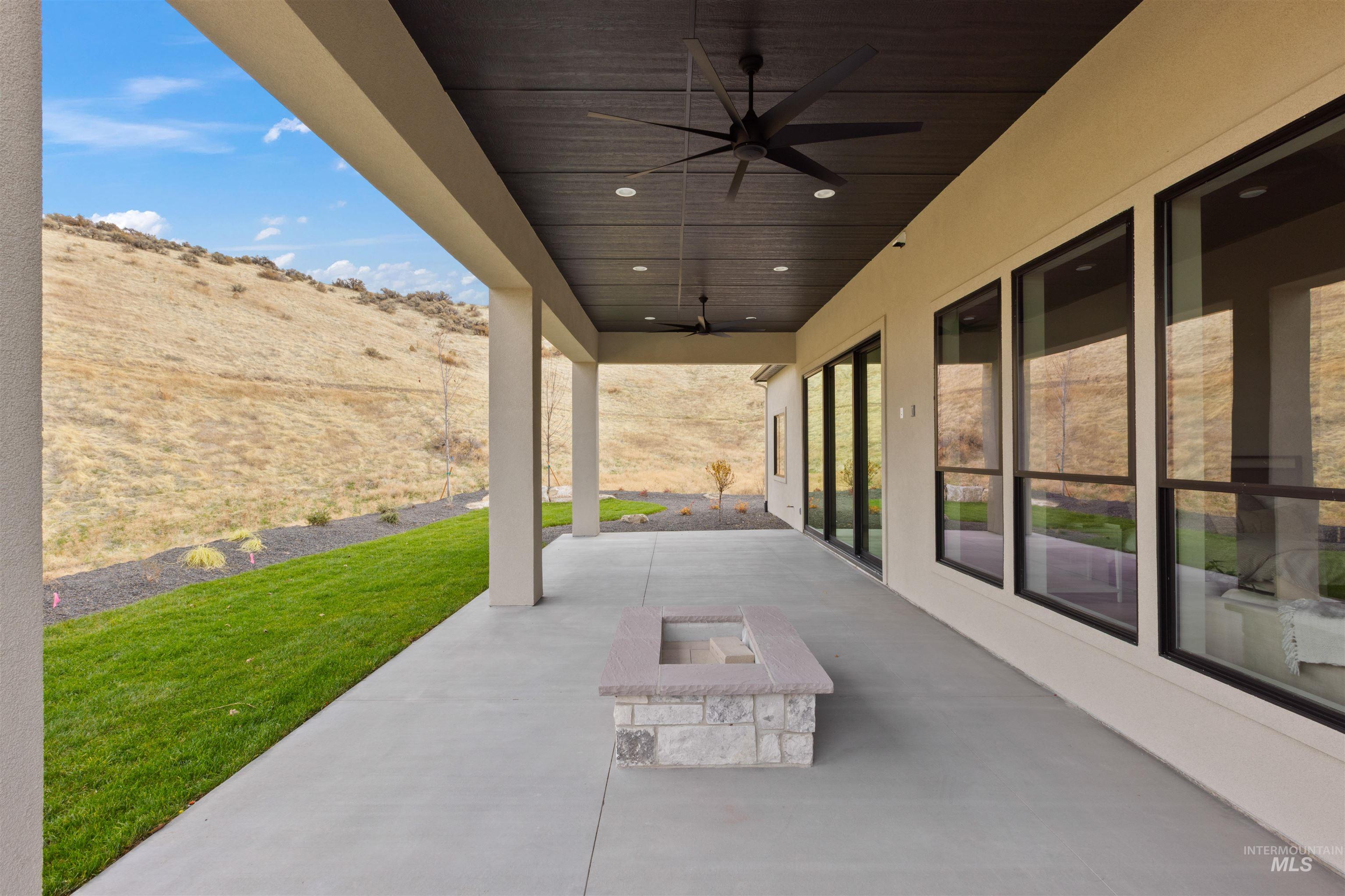 10968 North Elk Ridge Place Boise, ID 83714 - Photo 42 of 49 View of patio / terrace with ceiling fan and a fire pit