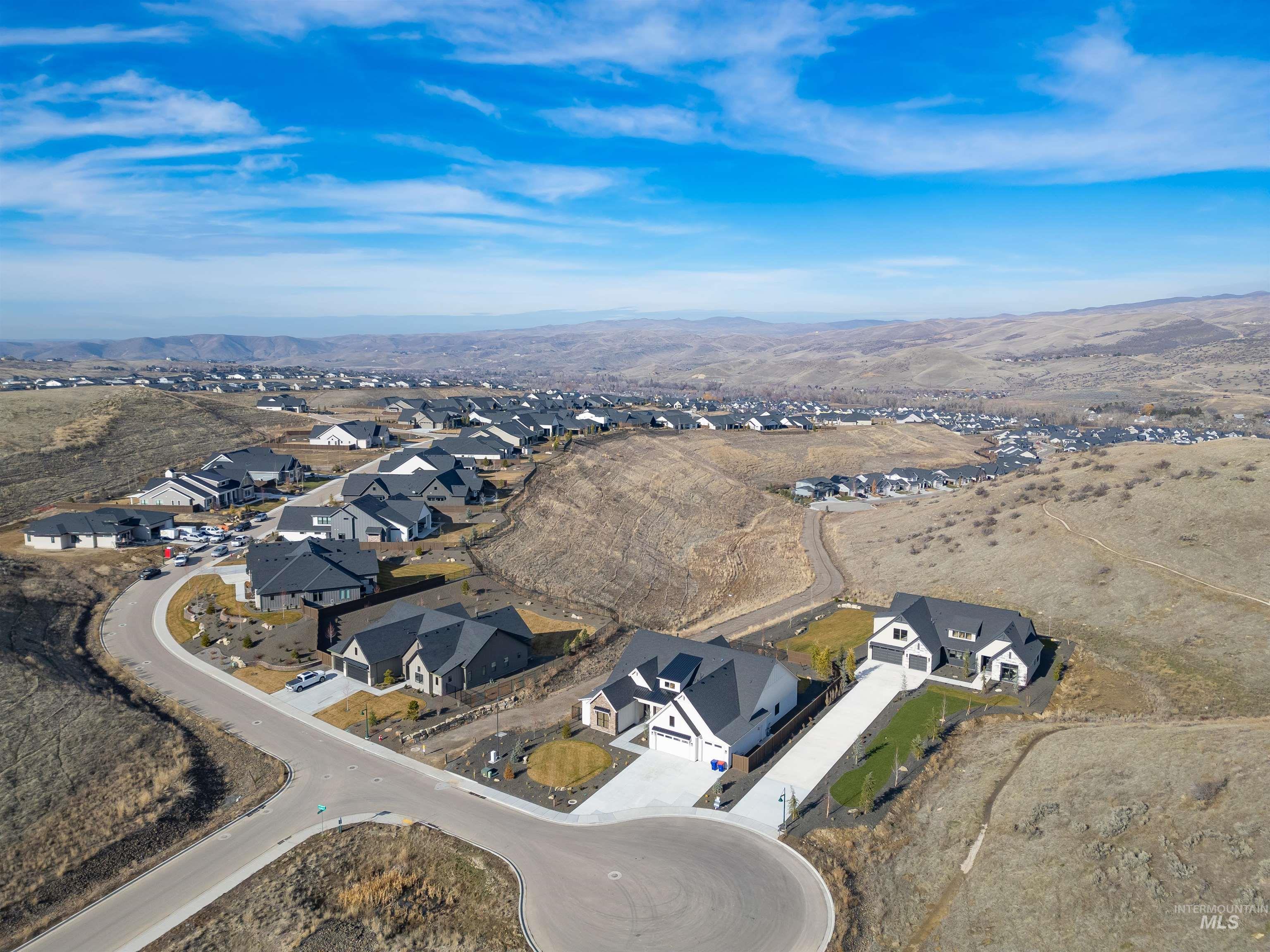 10968 North Elk Ridge Place Boise, ID 83714 - Photo 48 of 49 Aerial view of residential area featuring a mountainous background