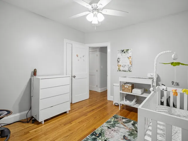 a view of a workspace with furniture and wooden floor
