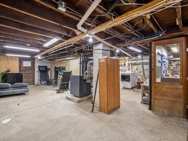 a view of a room with wooden ceiling