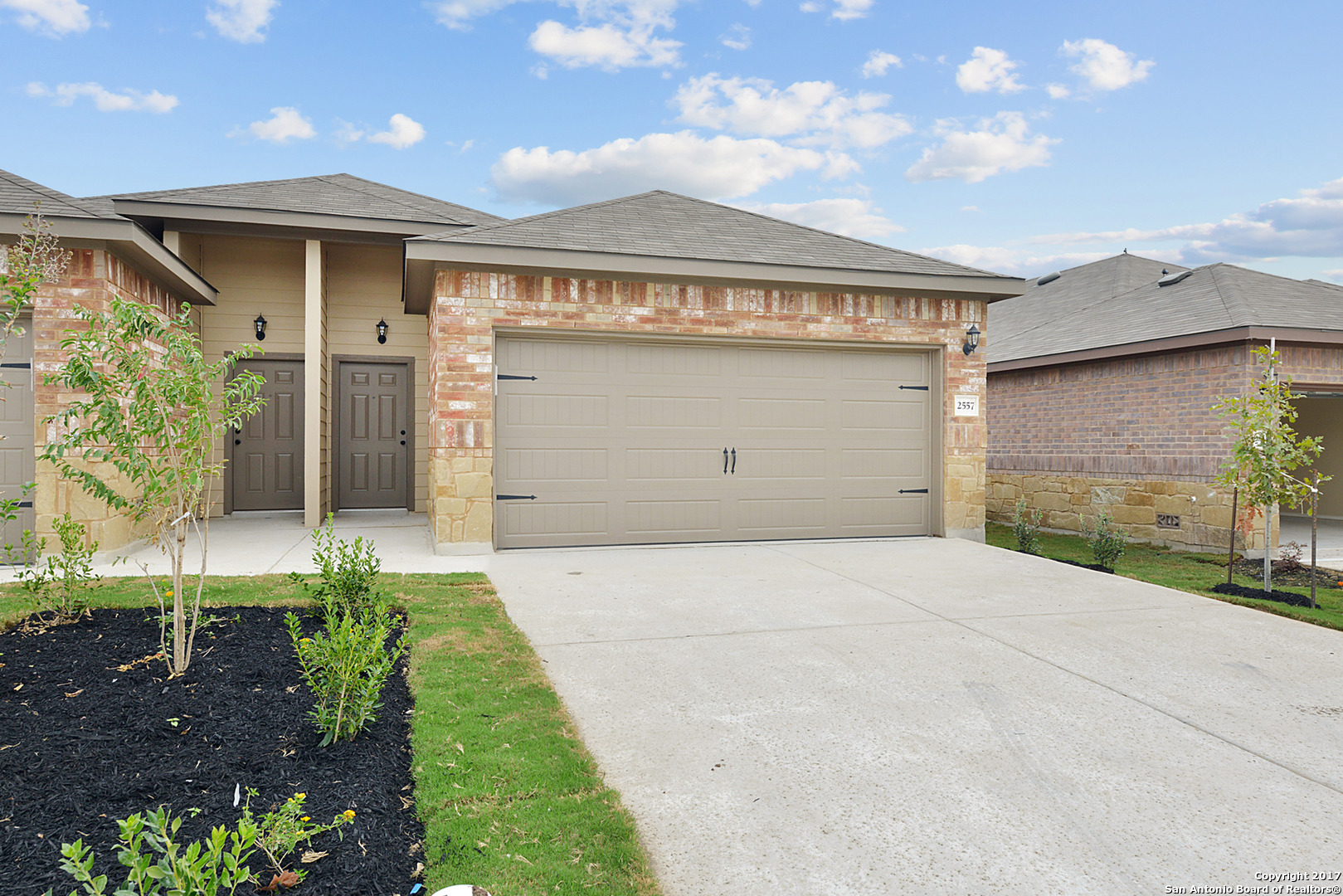 2557 Pahmeyer Road New Braunfels, TX 78130 - Photo 1 of 25 a front view of a house with a garden and plants