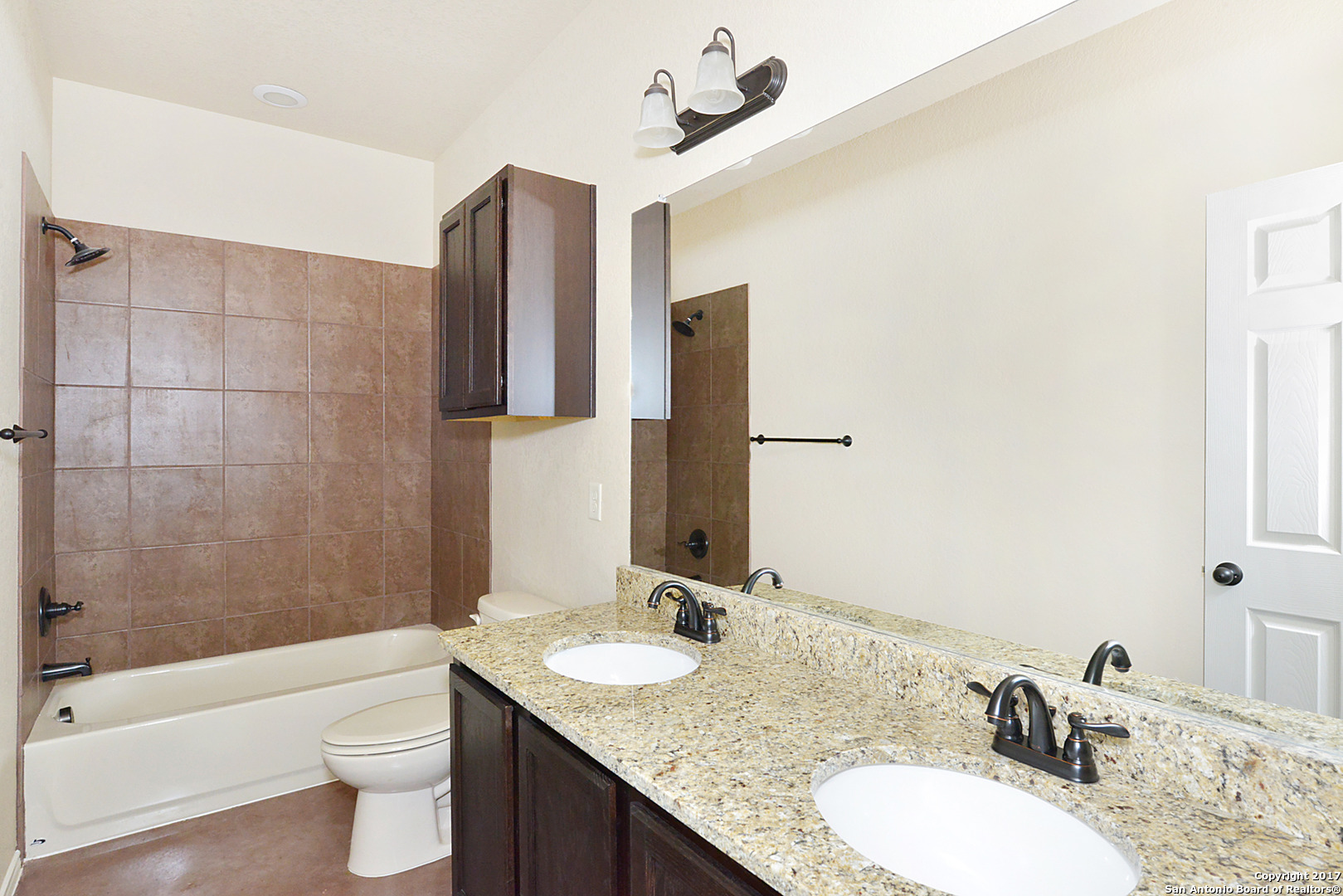 2557 Pahmeyer Road New Braunfels, TX 78130 - Photo 18 of 25 a bathroom with a granite countertop sink toilet and shower
