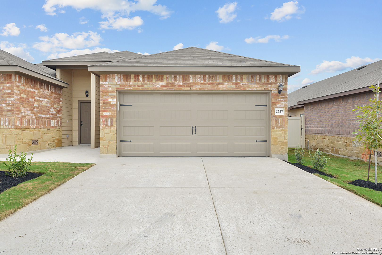 2557 Pahmeyer Road New Braunfels, TX 78130 - Photo 2 of 25 a front view of a house with a garage