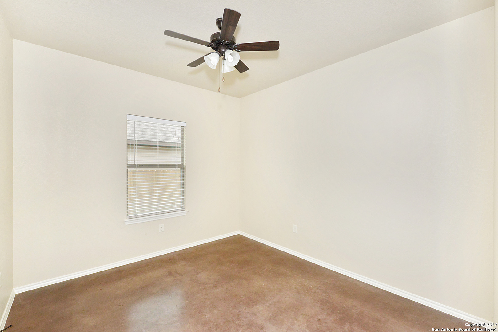 2557 Pahmeyer Road New Braunfels, TX 78130 - Photo 21 of 25 an empty room with a window and a fan