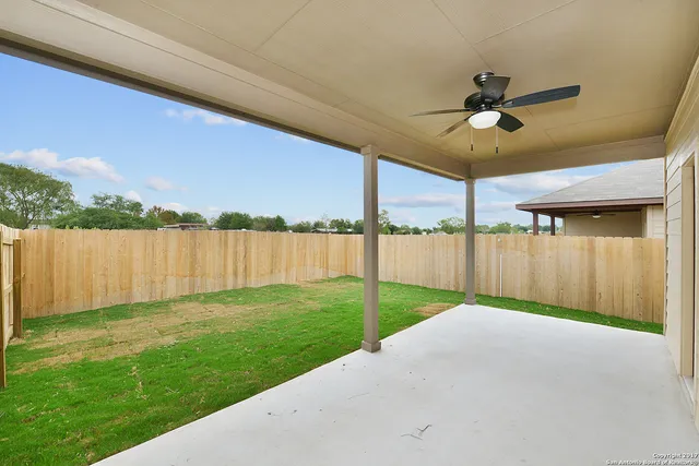 a view of a backyard with a garden and plants