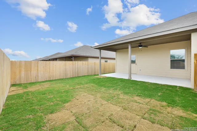 a view of a backyard with a garden