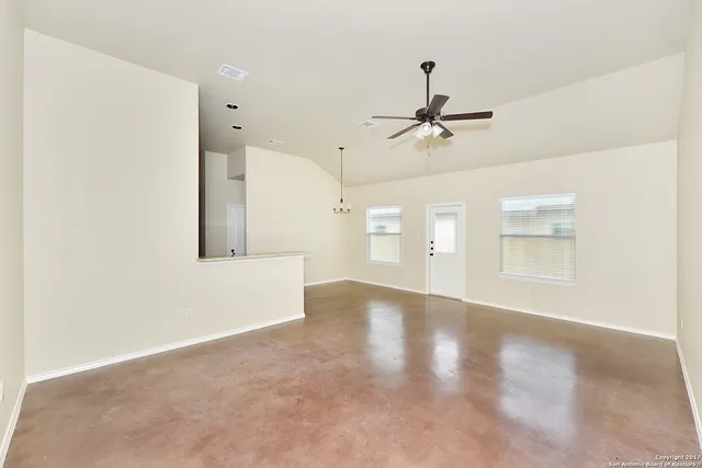 a view of an empty room with a window